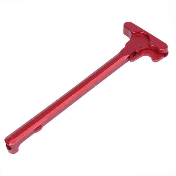 Red anodized aluminum AR-15 charging handle with extended latch.