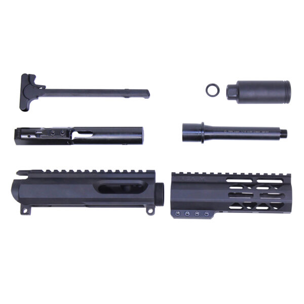 AR-15 upper receiver parts and tools laid out on white background.