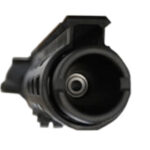 Close-up of semi-automatic pistol muzzle with visible rifling and serrated slide.