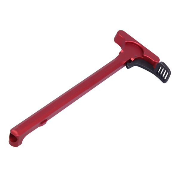 Red anodized aluminum AR-15 charging handle with black textured latch.