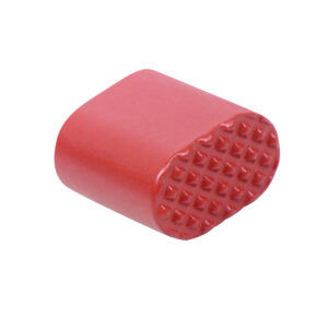 Red cylindrical tool with textured end featuring raised bumps for grip or massaging.