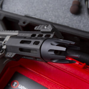 Close-up of AR-CLAW-308 muzzle device on 308 Pistol in protective case.