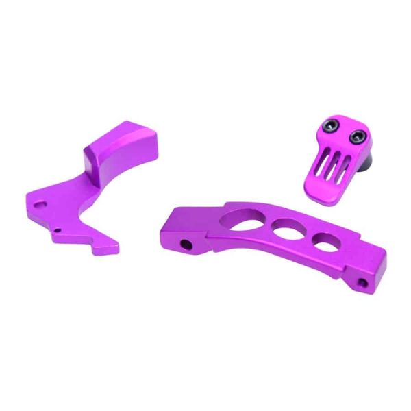 Anodized purple AR-15 parts: trigger guard, trigger assembly, grip enhancement.