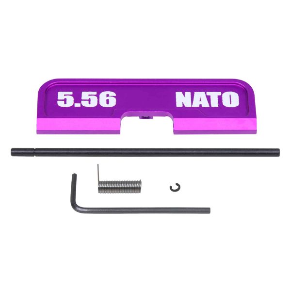 AR-15 Gen 3 purple dust cover with 5.56 NATO engraving and assembly tools.