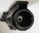 Close-up of black tactical firearm barrel with matte finish and structural details.
