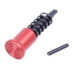 Red anodized AR-15 forward assist with spring, featuring target-like rings and black retention pin.