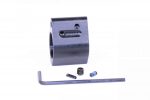 Black adjustable AR-15 gas block kit with tools on white background, showcasing precision craftsmanship.