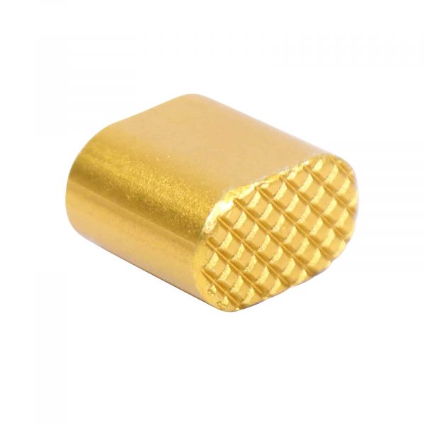 Gold anodized AR-15 extended magazine button with textured grip.