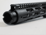 Matte black tactical AR-15 handguard with ventilation and rail system for accessory mounting.