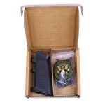 AR-15 kit with A2 pistol grip, black ergonomic design, and green part in plastic packaging.