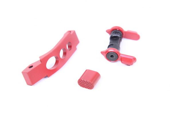 Red AR-15 lower upgrade kit with trigger guard, magazine release, ambidextrous safety, and Cerakote finish.