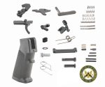 AR-15 parts kit with A2 grip; includes triggers, springs, and pins, neatly arranged.