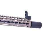 Modern AR rifle close-up with tan M-LOK handguard, black muzzle device, and front sight post.