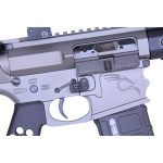 Close-up of silver AR-15 receiver showcasing magazine well and precision-machined aluminum construction.