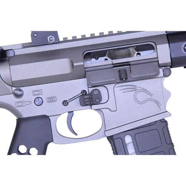 Close-up of silver AR-15 receiver showcasing magazine well and precision-machined aluminum construction.