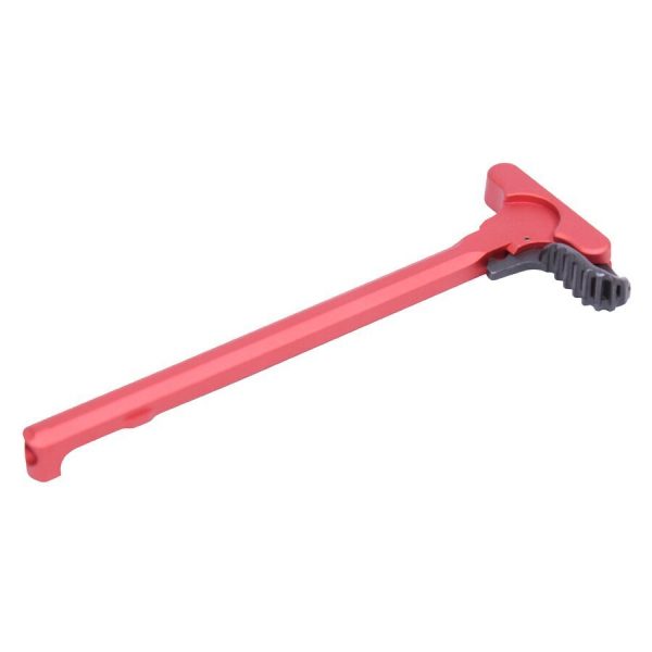 Bright red AR-15 charging handle with textured extended latch, anodized finish, ergonomic design.
