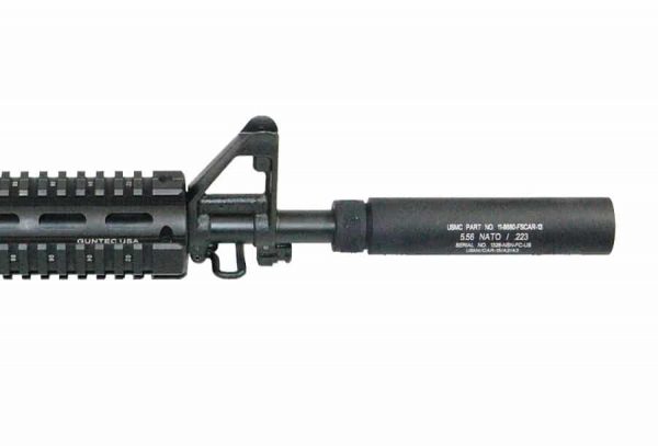 Close-up of tactical AR-15 with suppressor and quad rail on a white background.