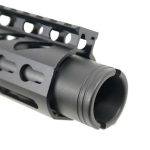 Close-up of a matte black tactical AR-15 handguard with Picatinny rail and ventilation slots.
