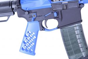 Close-up of custom blue AR-15 lower receiver with textured grip and translucent magazine.