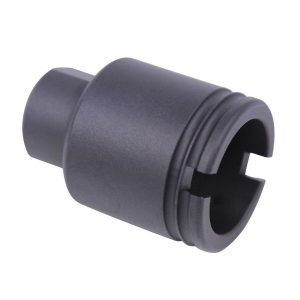 Matte black AR-15 accessory, possibly a flash hider, with grooves and cross-shaped opening.
