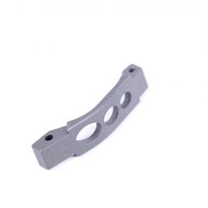 Lightweight AR-15 aluminum trigger guard with matte finish and oval weight-reducing cutouts.
