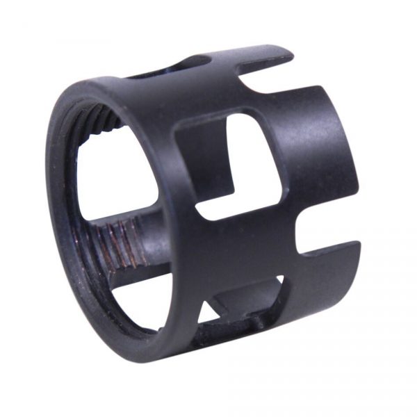 Matte black tactical barrel attachment with cutouts, machined metal; flash hider or muzzle brake.