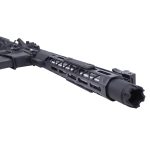 Close-up of matte black tactical firearm barrel and modular handguard with M-LOK rail slots.