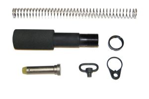 Disassembled AR-15 buffer tube kit with spring, buffer tube, retainer pin, and mounting components.