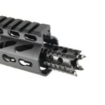 Black AR-15 muzzle brake with multiple ports, serrated edges, and tactical design.