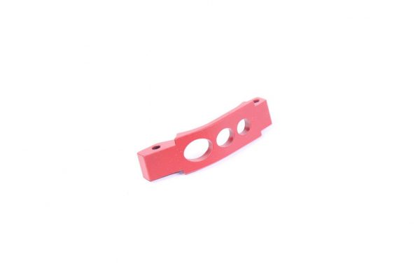 Red AR-15 enhanced trigger guard with three holes for improved grip and trigger accessibility.
