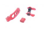 Precision red AR-15 parts: trigger guard, magazine release, ambidextrous safety.