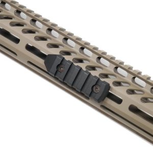 Close-up of Guntec USA tan M-LOK 3-inch rail with black Picatinny attachment.