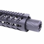 Close-up of tactical rifle barrel with ventilated rail and gray muzzle device.
