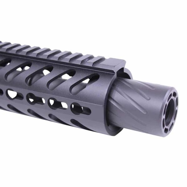 Close-up of tactical rifle barrel with ventilated rail and gray muzzle device.