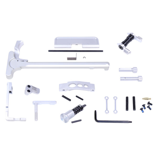 Mechanical assembly kit with L-shaped component and various metallic parts.