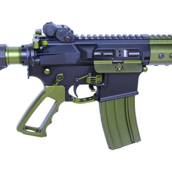 Close-up of a two-tone black and olive green tactical rifle with accessories.