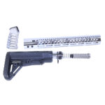 AR-15 disassembled parts, modern silver handguard, black buttstock, and muzzle brake.