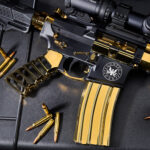 Luxurious gold-plated rifle with precision scope and bullets, indicating high craftsmanship.
