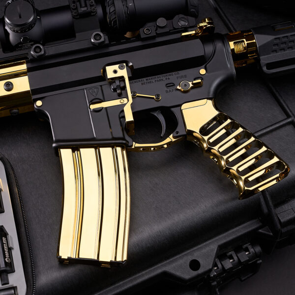 Luxury gold-plated AR-15 rifle with black accents and custom grip.