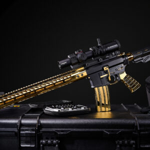 Gold-plated rifle with advanced scope and tactical case, showcasing luxury and precision.