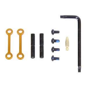 AR-15 anti-rotation pin set in orange with tools and screws, ideal for secure assembly.