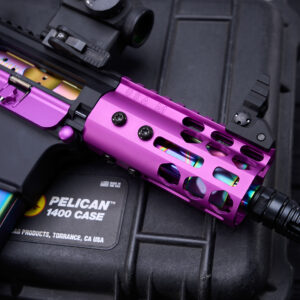 Custom purple GT-4MLK handguard on pistol with rainbow magazine, on Pelican 1400 case.