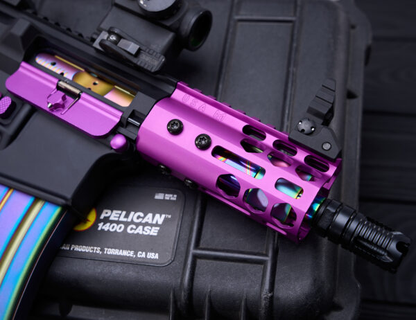 Custom purple GT-4MLK handguard on pistol with rainbow magazine, on Pelican 1400 case.