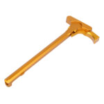 Golden T-shaped AR-15 charging handle, ergonomic and durable, for enhanced firearm performance.