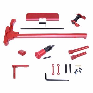 Red anodized AR .308 caliber firearm accent kit components on white background.