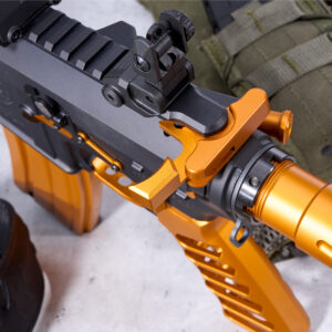 Close-up of CHARGE-G5-ORANGE pistol with tactical rail and orange accents on light background.