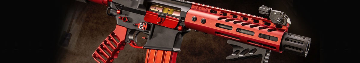 Red and black tactical firearm with adjustable stock and detailed design.