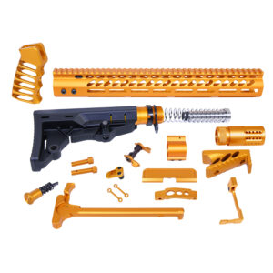 Gold and black AR-15 parts kit laid out on white background.