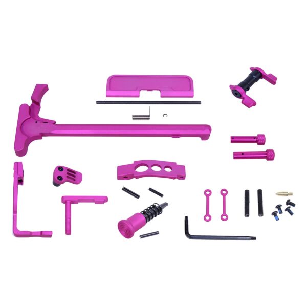 Pink AR-15 accessory customization kit with charging handle and various components.