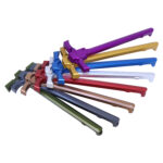 Colorful array of metal charging handles for firearms customization.